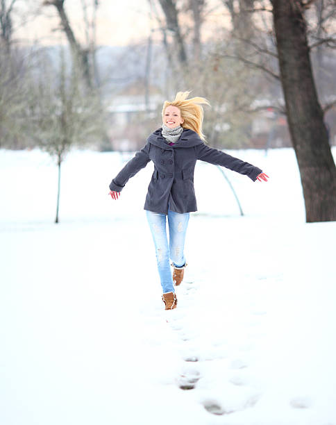istock Woman having fun on a snowy day. 187248104