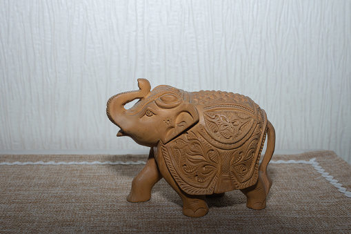 a figurine of a decorative carved elephant
