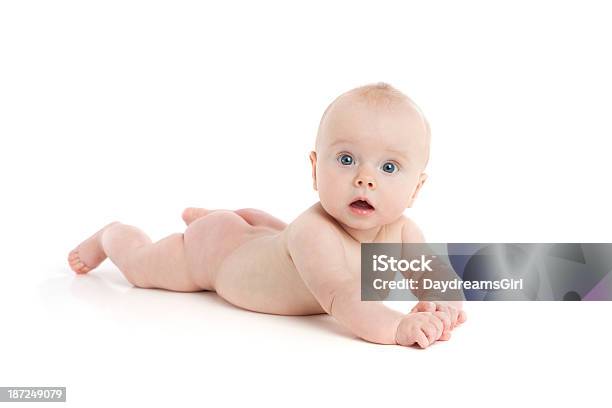 Foto de Lindo Bebê Deitado No Branco Andar Com Expressão Surpresa e mais fotos de stock de Bebê