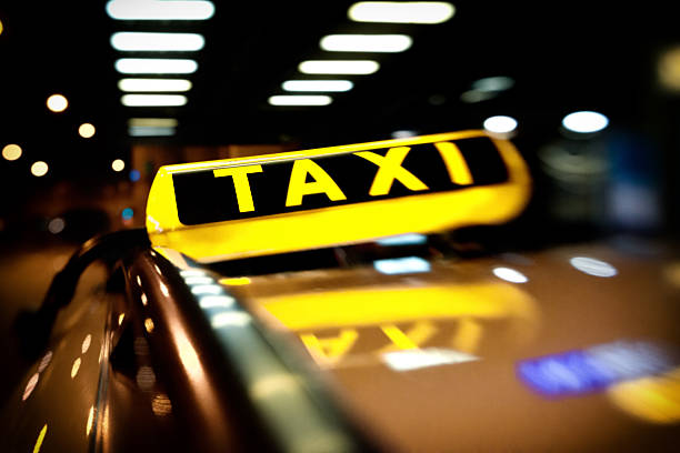 istock taxi sign at night 187249206