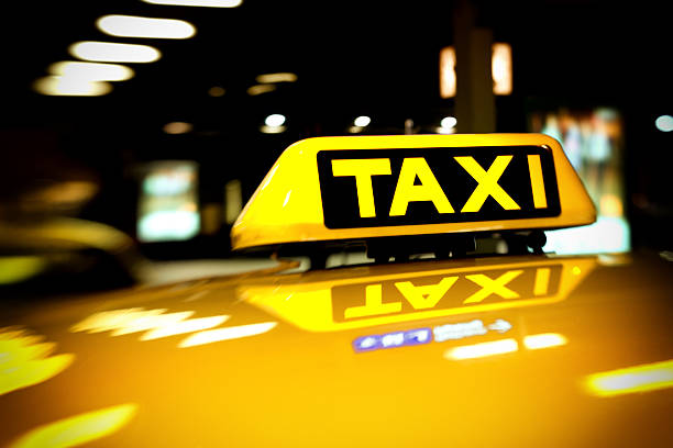 istock taxi sign at night 187249299