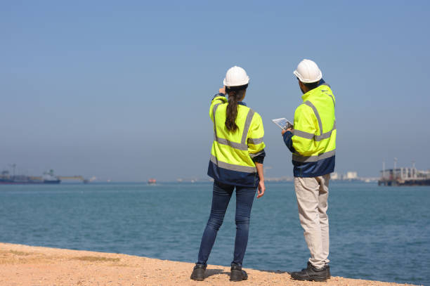 istock Two chemical engineers consult to prepare a work plan for a refinery storage tank. 1872507930
