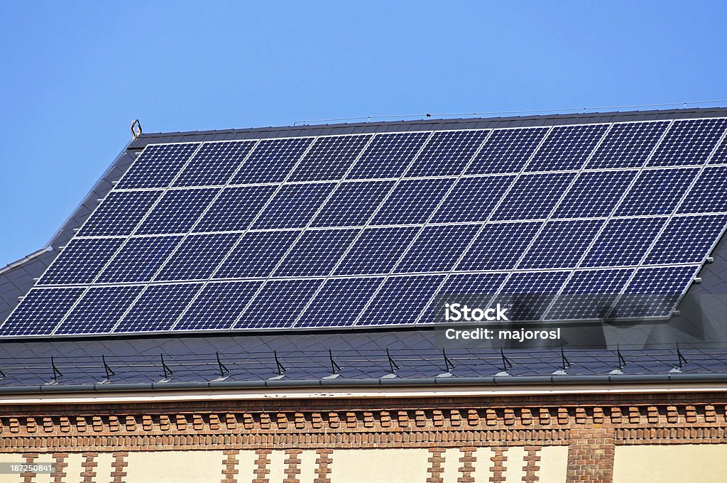 solar panels on the roof solar panels on the roof of an old style building Architectural Feature Stock Photo