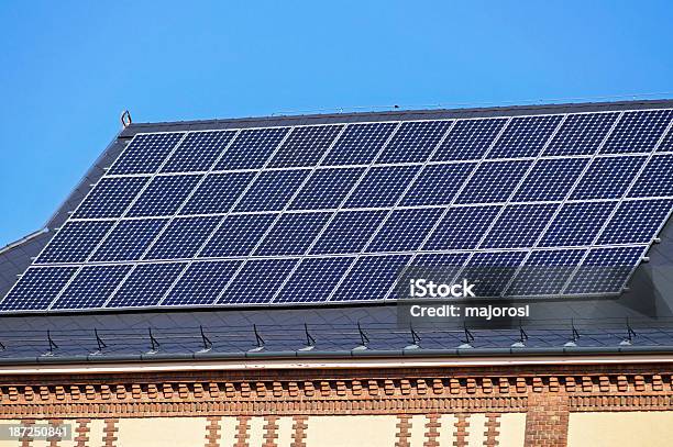 Solar Panels On The Roof Stock Photo - Download Image Now - Architectural Feature, Blue, Brick Wall