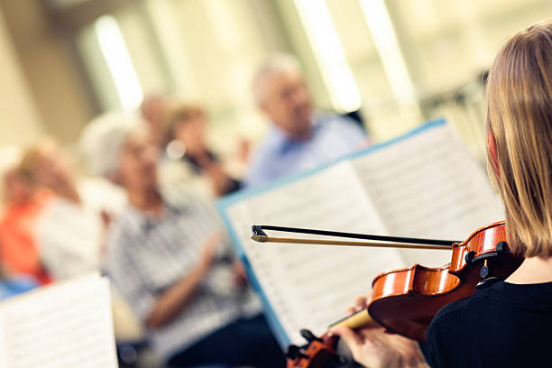 istock Teenager Playing On Classical School Concert 187250926