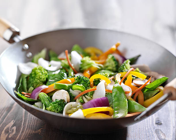 vegetarian wok stir fry close up photo of  a vegetarian wok stir fry shot with selective focus. Slective Focus stock pictures, royalty-free photos & images