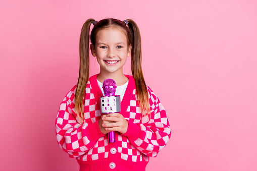 Photo of adorable cute charming girl wear trendy clothes live newscast broadcast reportage empty space isolated on pink color background.