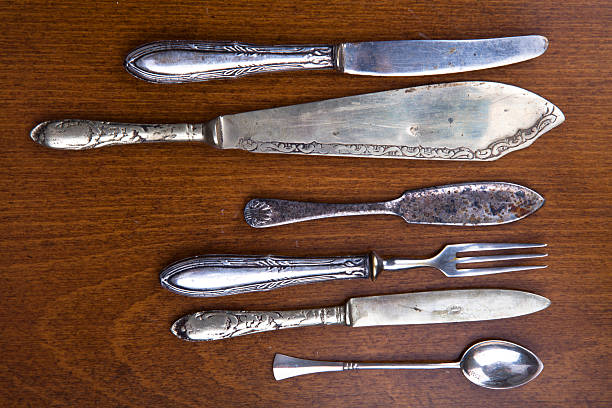 vintage couverts - tablespoon old scratched spoon photos et images de collection