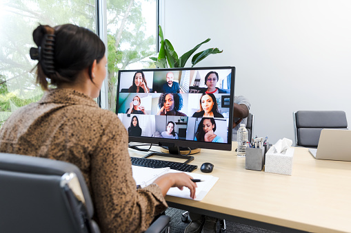 The young adult entrepreneur meets with an investor team to review her proposal.