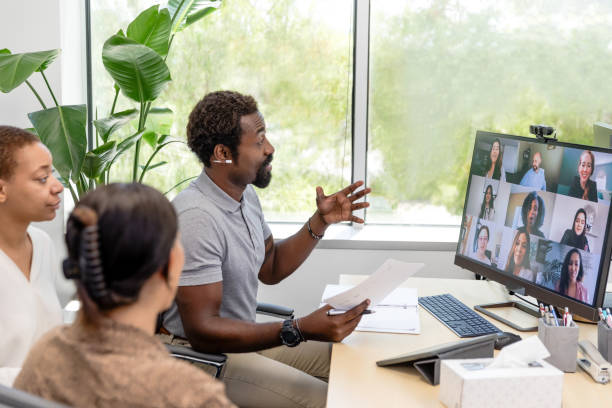 istock Leadership team sits together to host a virtual training for their employees 1872535075