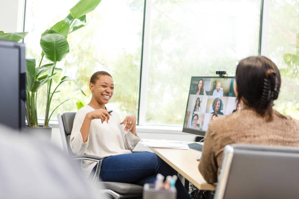 istock University students smile and enjoy conversation while meeting with their friends virtually 1872535105