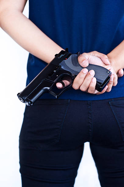 istock Gun In Woman Hand 187255190