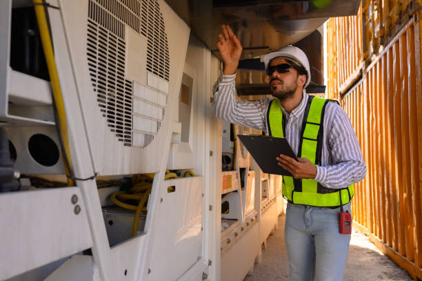 istock An engineer is inspecting the cargo entering the container. 1872557257