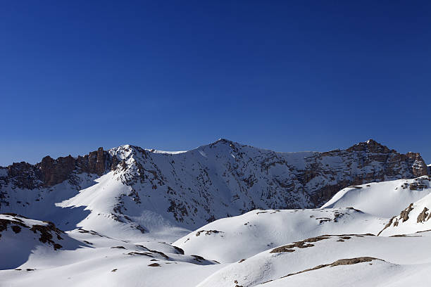istock Snowy mountains and blue sky in morning 187256009