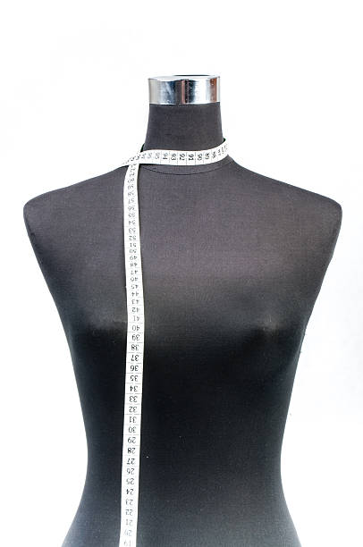 istock fashion dummy with measuring tape 187256478