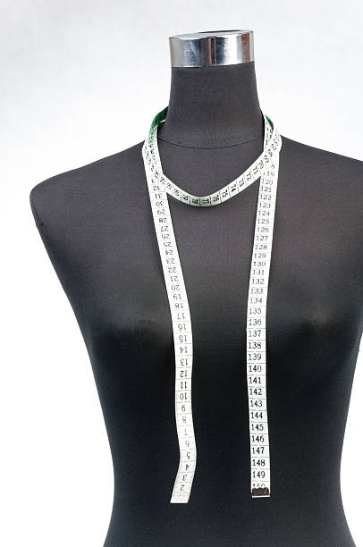 istock fashion dummy with measuring tape 187256502