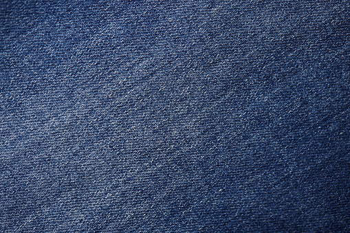 Fabric texture. Blue jeans background and texture. Close up of blue jeans background. Denim texture in high-resolution.