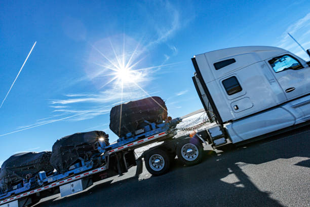 istock Speeding Semi Truck Passing Under Winter Wyoming Dramatic Sky 1872566908