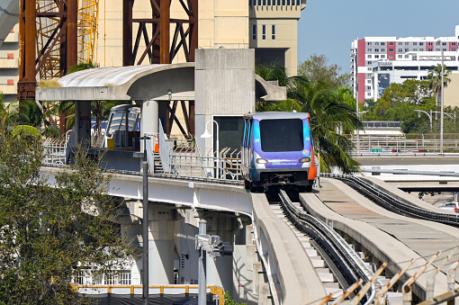 Miami, Florida, USA - 5 December 2023: Train on the Metromover light railway transit system which runs around downtown Miami. It is driverless and free to use.