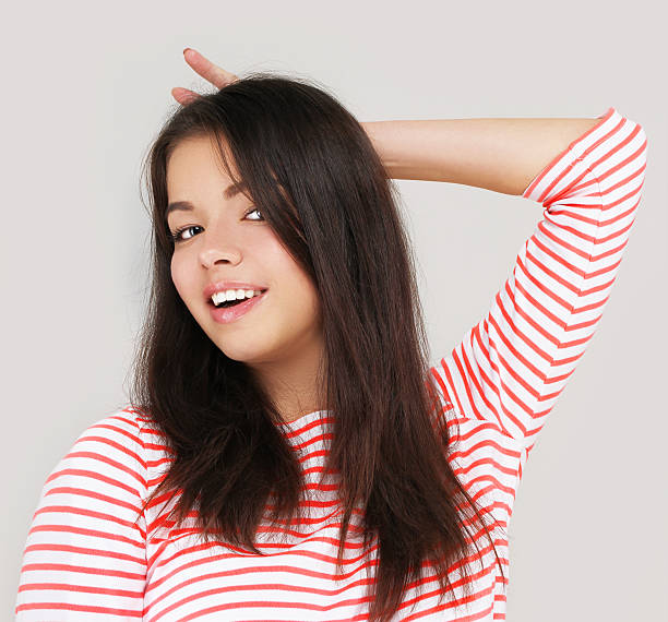 istock Grimacing.Funny girl  doing hand sign 187257506