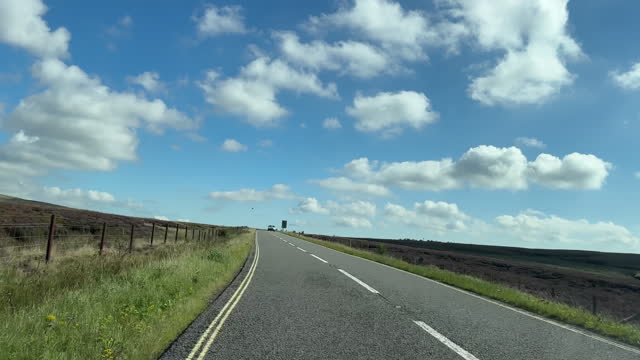Windscreen view driving on the top of Snake Pass Snake Road A57