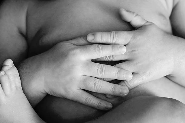 istock Newborn baby hands resting 187260016