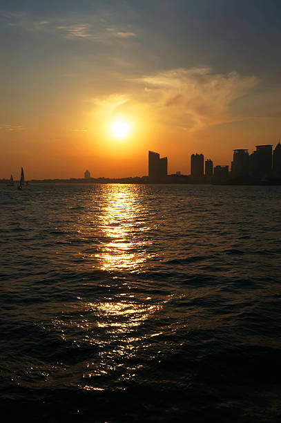 istock city sea boat sunset 187260838