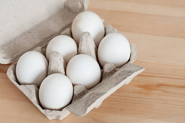 istock eggs in the box on wooden table 187261087