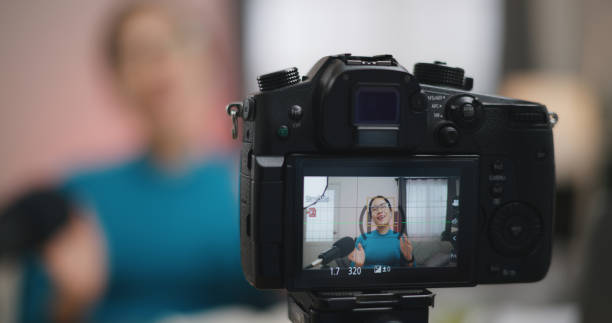 istock Young asian woman talking during recording video tutorial for internet 1872618175