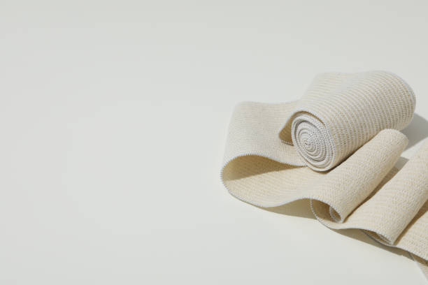 istock Help during an injury, elastic bandage on white background 1872618508