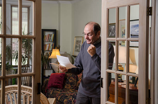 istock man reading letter at home_3 187262569