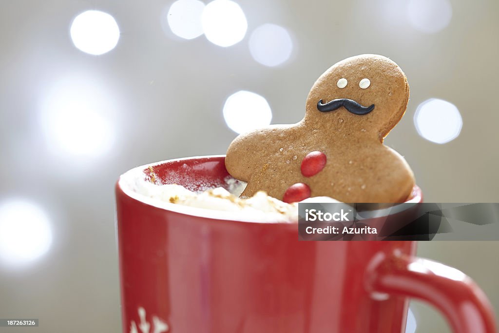 Gingerbread man in hot chocolate Gingerbread cookie men in a hot cup of cappuccino Gingerbread Man Stock Photo