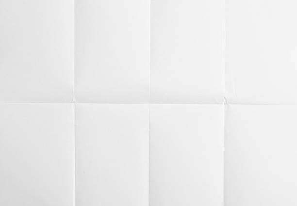 blanc feuille de papier plié à huit - textured folded white page photos et images de collection