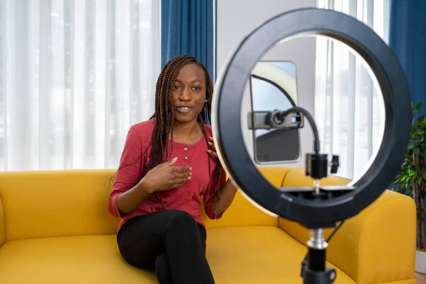 istock Smiling young African female influencer doing a vlog post at home 1872639397
