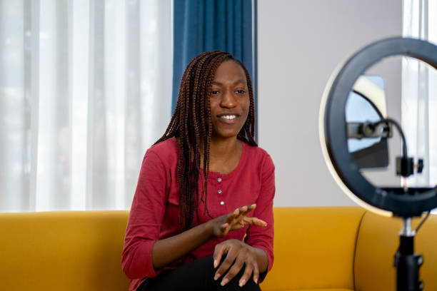 istock Smiling young African female influencer doing a vlog post at home 1872645399