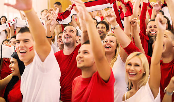 istock Group of ecstatic sport fans cheering. 187264874