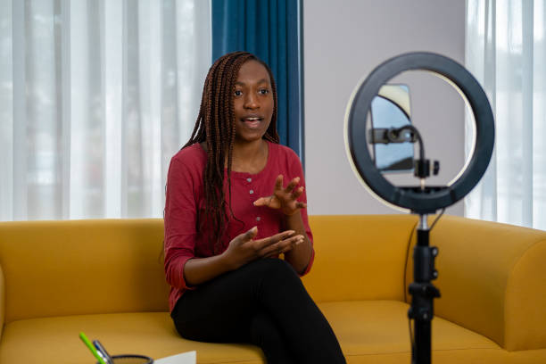 istock African woman vlogging at home 1872651084