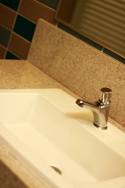 istock White Sink Faucet on a Marble Countertop 1872687365