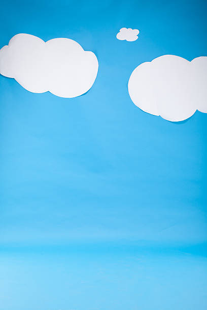 istock Children drawn paper clouds over real cardboard background 187270901