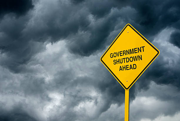 istock Government Shutdown Ahead Road Sign 187271044