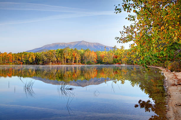 Mount Katahdin near Baxter State Park in Maine Mount Katahdin is the highest mountain in Maine. Katahdin is the centerpiece of Baxter State Park: a steep, tall mountain formed from underground magma. Photo taken during the fall foliage season. Maine fall foliage ranks with the best in New England bringing out some of  the most beautiful foliage in the United States mt katahdin stock pictures, royalty-free photos & images