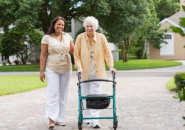 istock Senior woman with caregiver 187271506