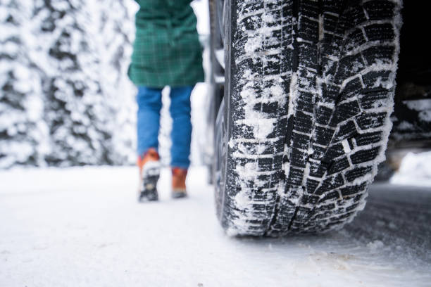 istock Road covered with snow and ice. 1872717600