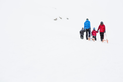 Family walking in winter landscape
