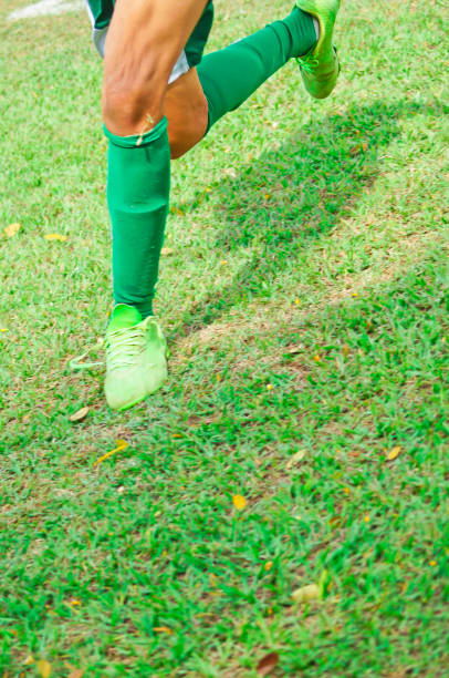 istock Football player running on the field 1872720809