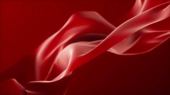 Abstract red colored flowing fabric