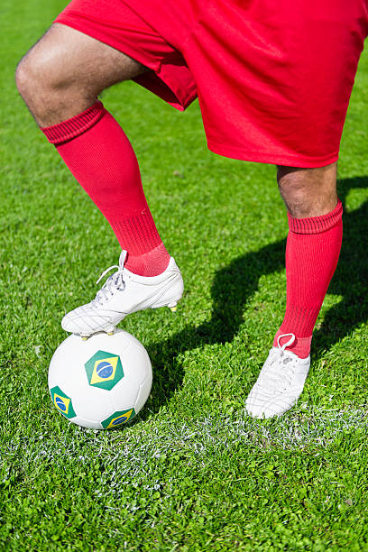 istock Soccer player with ball 187272356
