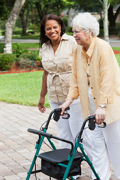 istock Senior woman with caregiver 187272423