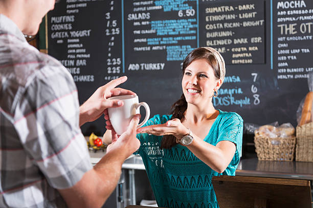 istock Woman working in restaurant helping customer 187272468