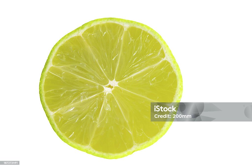 Citron vert partielle sur blanc - Photo de Agrume libre de droits